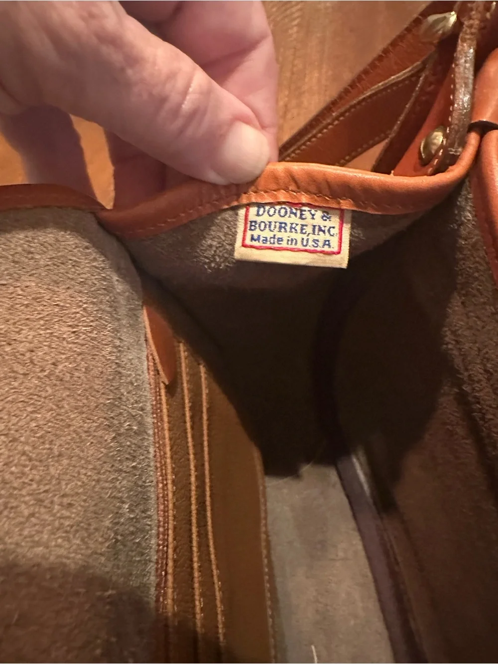 Dooney & Bourke Brown Pebbled Leather Horseshoe Crossbody with Tan Trim